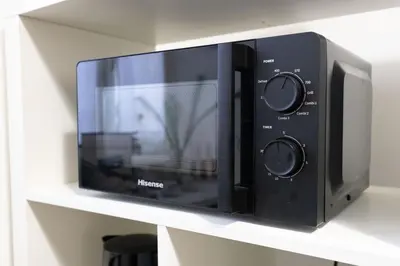 a microwave oven sitting on a shelf at Br1tannia 36 in Rome