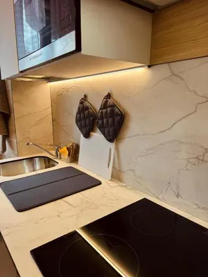 a kitchen with a sink and a counter with two mugs at Casa Umbertina in Rome