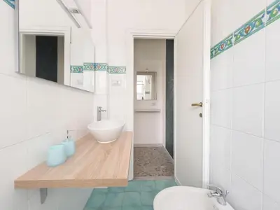 a bathroom with a sink and a toilet at Vintage Charm & Comfort - Garbatella in Rome