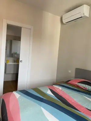 a bedroom with a bed with a colorful blanket at Duck House Gemelli in Rome