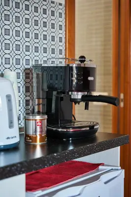 a coffee maker sitting on top of a counter at kis inn affitacamere guesthouse in Rome