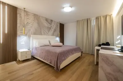 a small bedroom with a bed and a desk at Vivi Roma in Rome