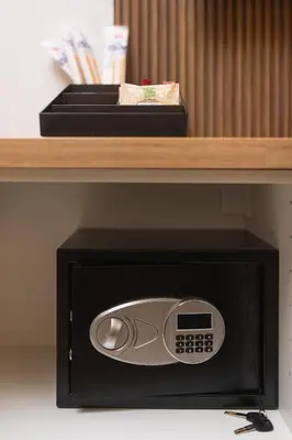 a microwave oven with a box on a shelf at Vivi Roma in Rome