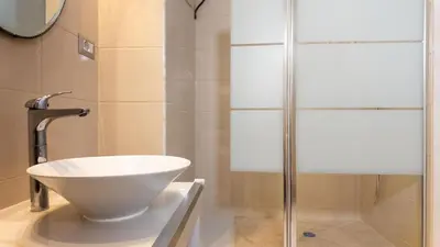 a bathroom with a sink and a shower at Roma Palace Suite in Rome