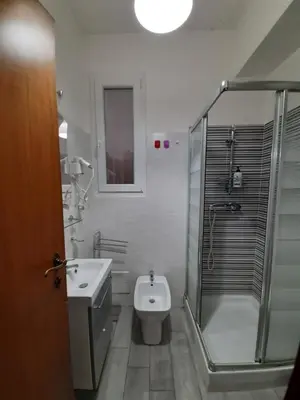 a bathroom with a shower and a toilet and a sink at Lovely flat next to vatican - private entrance in Rome
