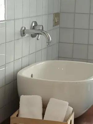 a bath tub in a bathroom with a faucet at Casa verde di Mia in Rome