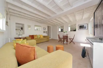 a living room with a couch and a table at Colosseo nei Fori Imperiali by Luxury Getaways in Rome