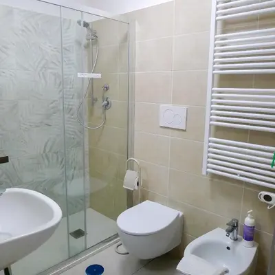 a bathroom with a shower and a toilet and a sink at Nuovo monolocale a 15 minuti dalla Stazione Termini in Rome