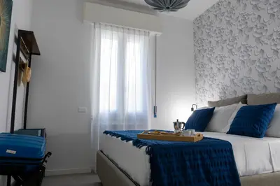 a bedroom with a bed with a tray on it at Roma 2 minuti a piedi dal Vaticano in Rome
