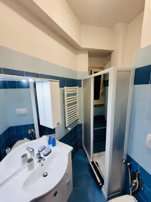 a bathroom with a sink and a shower and a toilet at House 5 minutes walk from Vatican Museums in Rome