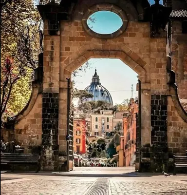 a view of the capitol building through an archway at House 5 minutes walk from Vatican Museums in Rome