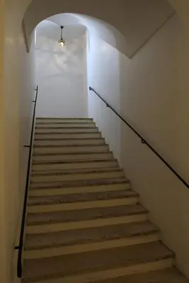 a staircase in a building with a light on it at Vicolo del Lupo Guesthouse in Rome