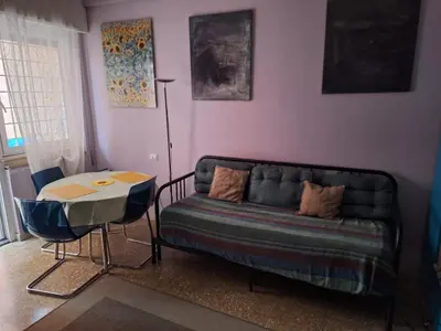 a living room with a couch and a table at Il Pineto in Rome