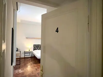 a room with a door with the number four on it at Marbel's Rooms in Rome