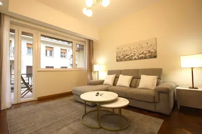 a living room with a couch and a table at Contessa 3BR Holiday House in Rome