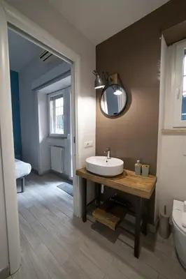 a bathroom with a sink and a mirror at Loft Aurelia 336 in Rome