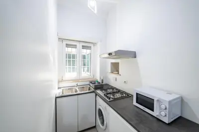 a kitchen with a sink and a microwave at Loft Aurelia 336 in Rome