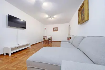 a living room with a couch and a flat screen tv at Pantheon Apartment Rondanini in Rome