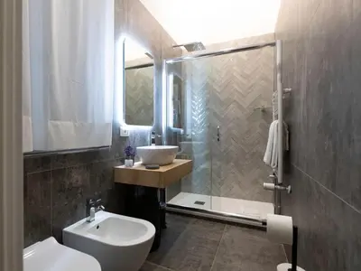 a bathroom with a sink and a toilet and a shower at BNB Ostiense in Rome