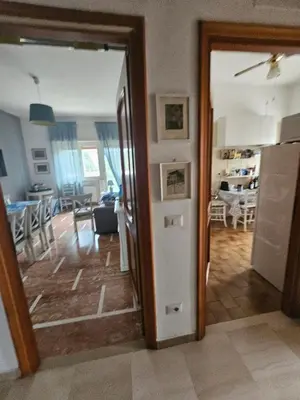 a room with a kitchen and a living room at CS Banco Apartment in Rome