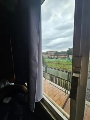 a window in a room with a view of a field at CS Banchetto Apt 2 pax in Rome