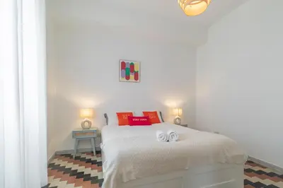 a bedroom with a bed with two towels on it at Domus Ana- Modern Elegance, steps away from the colosseum and the historic center in Rome