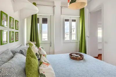 a bedroom with a bed with a basket on it at Menta luxury apartment Rome in Rome