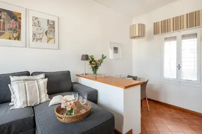 a living room with a couch and a table at Menta luxury apartment Rome in Rome