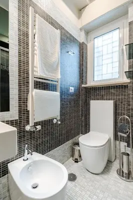 a bathroom with a white toilet and a sink at Welcome to Retreat in Trastevere in Rome