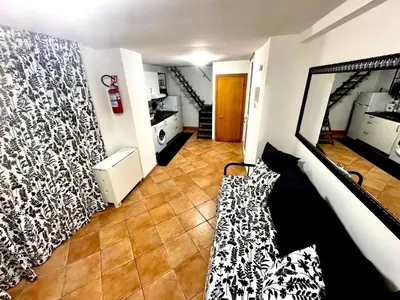 a bedroom with a bed with black and white wallpaper at Machiavelli House in Rome