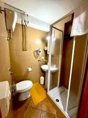 a bathroom with a shower and a toilet and a sink at Machiavelli House in Rome