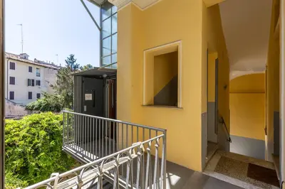 an open hallway with potted plants in a building at Calm Home - Center Rome in Rome