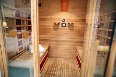 a small sauna with wood paneling in a room at Escape Suite Guest House - Ca Domus Collection in Rome