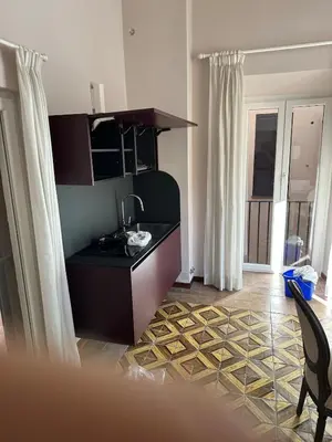 a kitchen with a sink and a counter top at Luxury house Empire 96 in Rome
