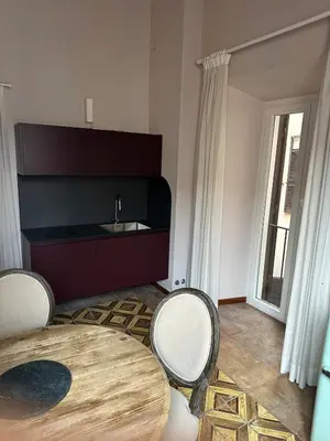 a living room with a table and two chairs at Luxury house Empire 96 in Rome