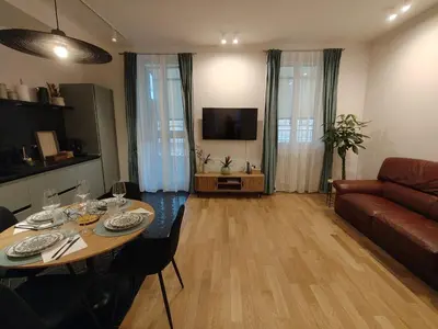a living room with a table and a couch at Bellissimo bilocale al centro di Roma - Daniele Case Vacanza in Rome