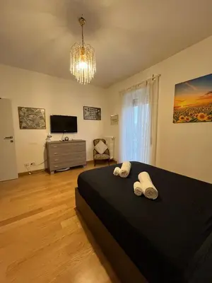 a bedroom with a bed with two towels on it at Casa Conca D Oro in Rome