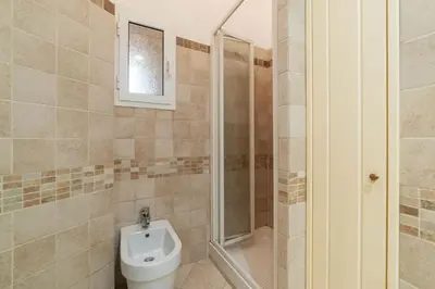 a bathroom with a toilet and a shower at GuestHost - Historic Apartment in Sallustiano in Rome