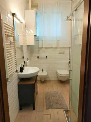 a bathroom with a sink and a toilet at Casa Flegrei in Rome
