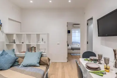 a living room with a couch and a table at Residenza Margherita in Rome