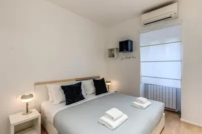 a bedroom with a bed with two towels on it at Residenza Margherita in Rome