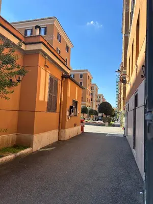 an empty street in an alley between two buildings at Fast Re Apartment in Rome