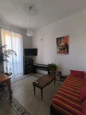 a living room with a couch and a piano at Cozy Room in Rome