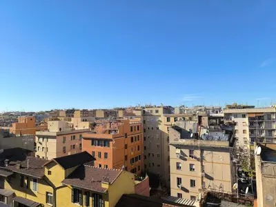 an aerial view of a city with buildings at Cozy Room in Rome