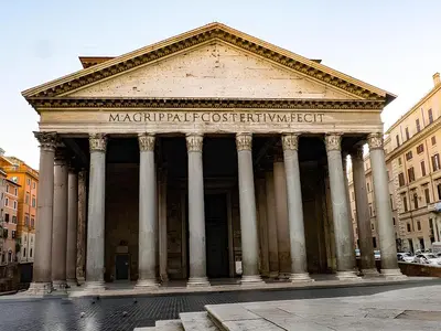 a large building with columns in a city at Casa Roma in Rome