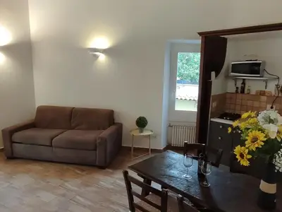 a living room with a couch and a table at House Moro in Rome