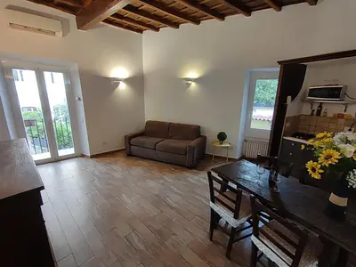 a living room with a couch and a table at House Moro in Rome