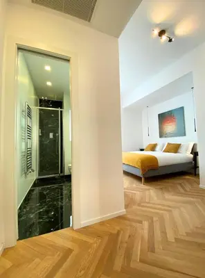 a bedroom with a bed and a glass doorway at Spacious Apartment with Outdoor Terrace near Vatican - Casa Vacanze Romane in Rome