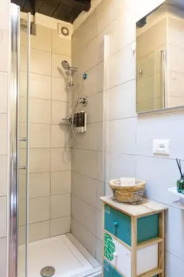 a bathroom with a shower and a sink at 