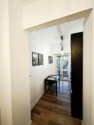 a hallway with a table in the middle of a room at DOMUS Villa Chigi in Rome